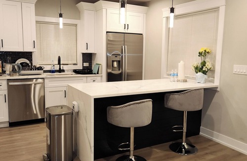 Chester Highlands House | House with garage, outdoor dining and basement bar