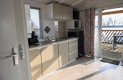 Suderstapel House | Houseboat 1 on the Eider - your floating mini-holiday home with river views