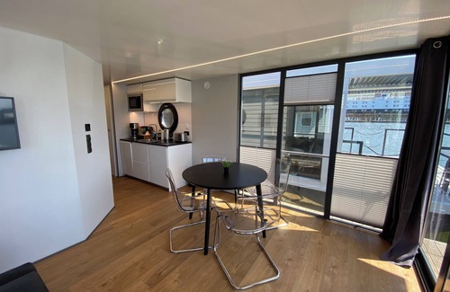 Lundby Boat Rental | Houseboat KUNGSVIKEN with roof terrace in the center of Gothenburg