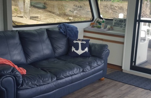 Coopersville Boat Rental | Houseboat on Grand River on private wooded lot