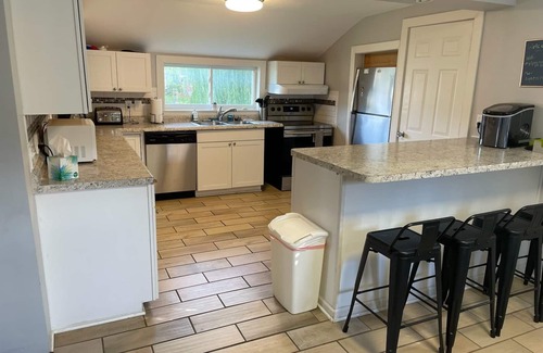 Elk Rapids House | Huge corner lot, home is a 2-minute walk to beach, playground, and park