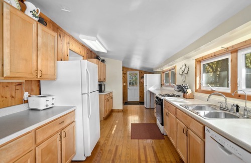 Newaygo House | Huge lake house. 3 levels. 9 bedrooms. Great for groups. Large beach. Fire pit.