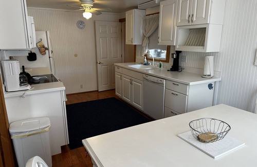 Oscoda House | Huron Winds kiddy corner to Lake Huron and near the Oscoda splash park!