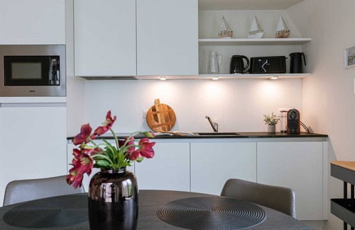 Westende Apartment | Huswell - Wide top-floor apt with private parking