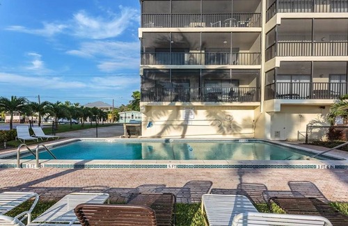 Mid Island Condo | Ideal Beachfront location, Spectacular Sunsets, Bright Lovely Corner Condo
