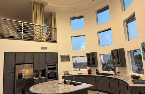 Rancho Oakey Condo | Incredible 2 level loft with 30ft ceilings -expansive balcony with STRIP VIEWS!