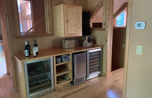 Beaver Island Cottage | Indoor/outdoor living at its best in this stunning lakeside home.