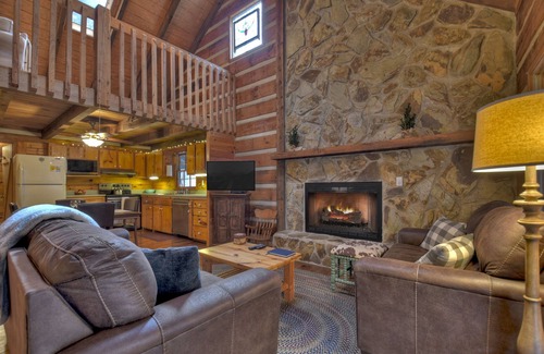 Dial Cabin | Indulge in "Just One More Night", a pet-friendly creekfront retreat boasting a spacious outdoor deck, hot tub, firepit, and WiFi