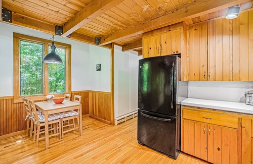 Benzonia House | Inviting home in great location with large deck, firepit, gas grill & streaming