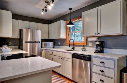 Glenville House | Inviting house near Lake Glenville with firepit, fireplace, grill, porch, & deck