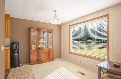 Harrison House | Inviting lakefront home with dock, fireplace, mountain view, & W/D