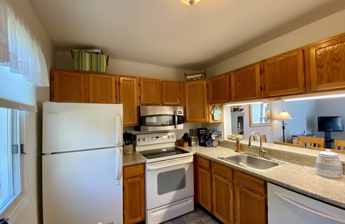 Brewster Condo | Inviting private patio, charming décor, and a wonderful location close to Pool, Tennis and Fitness.