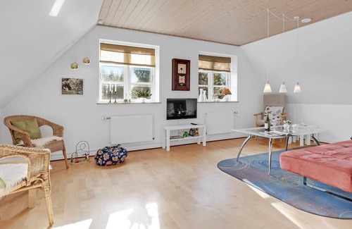 Sabro Apartment | Inviting vacation home with wood stove and grounds, located in a cozy town outside Arhus.
