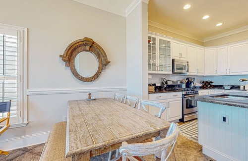Waters Edge House | Inviting waterfront townhouse with beach access, balcony, W/D, pool & dock