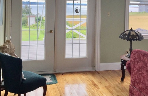 Port Hood Cottage | Island Retreat in Elegantly Restored Schoolhoue with Panoramic Ocean Views