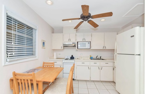 George Town Cottage | Ixora West - Views over Elizabeth harbor, beach access across the road.