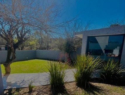 Comuna Estancia Vieja House | Jacarandá