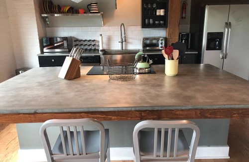 Downtown Rochester Apartment | JOEY'S PLACE - A MODERN SOPHISTICATED INDUSTRIAL OPEN SPACE LOFT