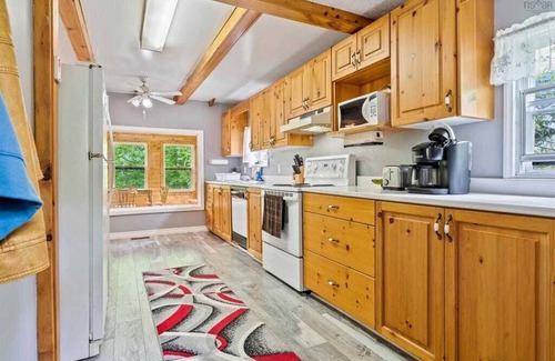 Aldersville Cottage | June's Haven" is a picturesque lakeside cottage perfect for fishing
