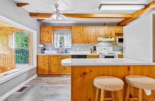 Aldersville Cottage | June's Haven" is a picturesque lakeside cottage perfect for fishing