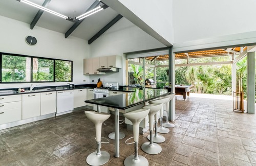 Tarcoles House | Jungle dog-friendly home with ocean views from the pool, gas grill & pool table