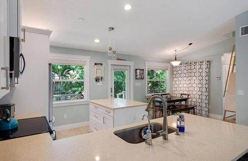 Jupiter House | Jupiter Farms Tropical Oasis with Lush Landscaping
