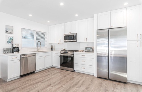 West Newport Condo | Just Listed! Clean, modern, bright, and only steps from the best beach in California!