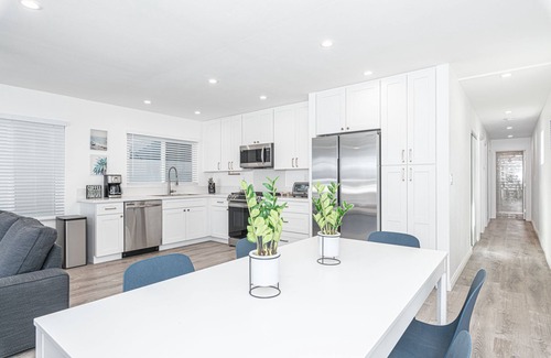 West Newport Condo | Just Listed! Clean, modern, bright, and only steps from the best beach in California!