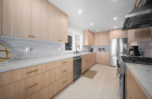 Balboa Peninsula House | Just Renovated Bay Facing Coastal Home with a Dock