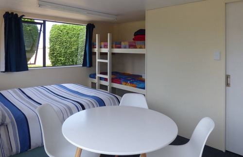 Karitane Apartment | Karitane absolute-seaside self-contained family holiday studio, 2 adults, 2 kids