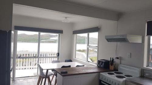 Raglan House | Karoro the beach front bach with views to die for!