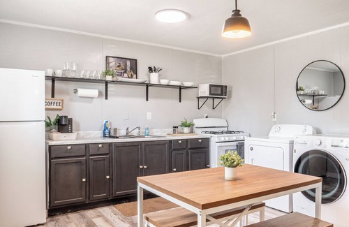 Abilene Condo | Kick back and relax in this calm, stylish space.
