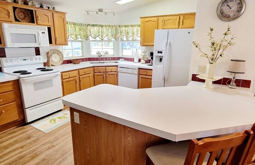 Edgewater House | Kick Back & Relax with two pools, a boat launch, community pier and more!