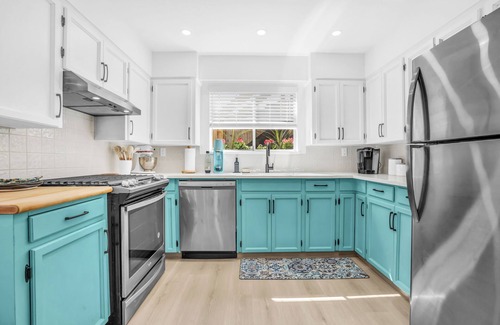 Lynn Valley House | King Bed with front door parking and private courtyard. Designed for living.