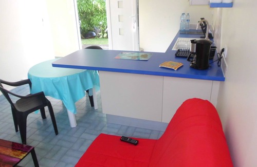 Saint-Claude House | Kitchen-living room and air-conditioned bedroom, at the foot of La Soufrière.