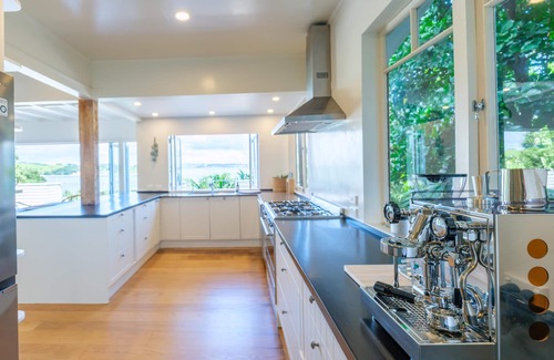 Omiha House | Koi Waiheke - Koi Waiheke is a stunning luxury holiday home in Omiha, Waiheke Island. With 4 bedrooms; 4 bathrooms; a large entertainer’s kitchen; spectacular ocean views; a private mooring; and a boat shed offering direct access to the ocean. This i