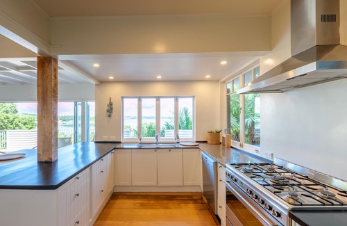 Omiha House | Koi Waiheke - Koi Waiheke is a stunning luxury holiday home in Omiha, Waiheke Island. With 4 bedrooms; 4 bathrooms; a large entertainer’s kitchen; spectacular ocean views; a private mooring; and a boat shed offering direct access to the ocean. This i