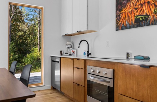 Acme House | KOTI 6 (Two Bedroom) Traverse City's Scandinavian Cabins, vacation home on TART & mins to Traverse C