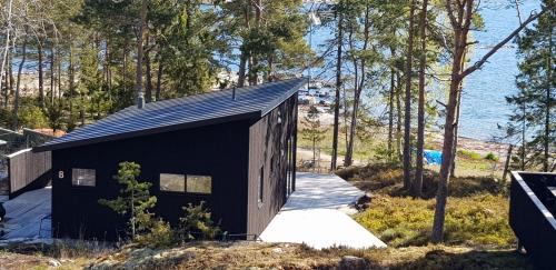 Grisslehamn Cabin | Kvarnsands Strandstugor/Kvarnsand Beach Lodges
