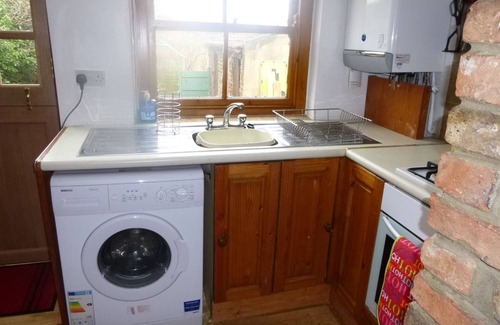 Bedale Cottage | Laburnum Cottage. Long enclosed dog friendly garden leading to the beck.