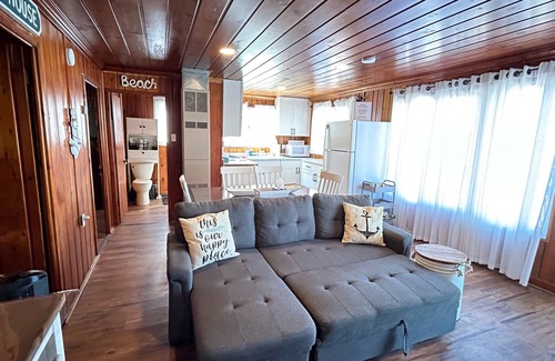 National City Cottage | Lake/beach front property with kayaks, pedal boat, & row boat, near Tawas Bay