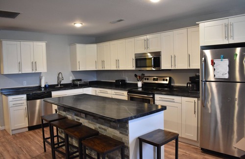 Monroe City House | Lake cabin sleeps 18+ w/ a hot tub near Mark Twain Lake and waterpark!