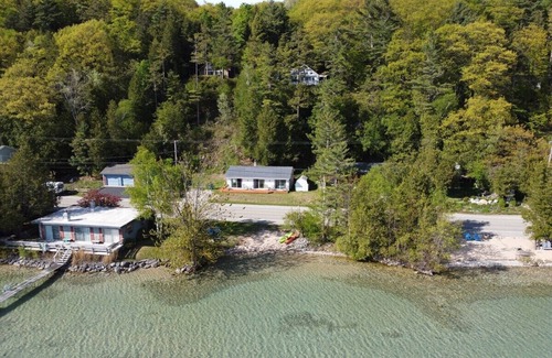 Lake Township Cottage | Lake Escape - PRIVATE LAKEFRONT WITH KAYAKS, DOCK, AND BEACH BONFIRE RING!