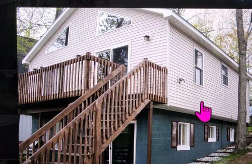 Le Roy House | Lake Front Cottage on Private All-Sports Lake.