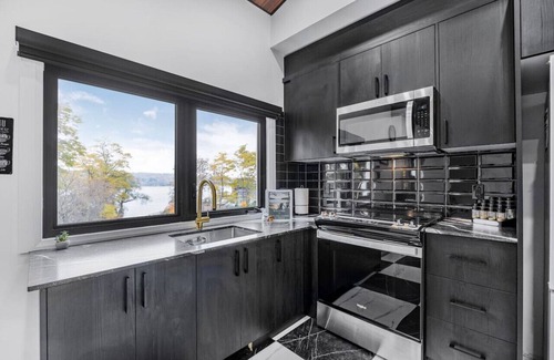 Penetanguishene Apartment | Lake Front Family Getaway - Sandy Beach!