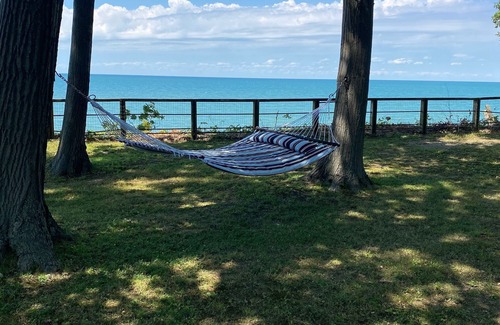 Irving House | Lake Front Home. Private stairs to private beach and bay. upscale 5 bedroom home