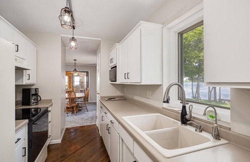 Isle House | Lake home, 3 bd 3 bath, 2 car garage deck, dock, Video game, foosball, quiet bay