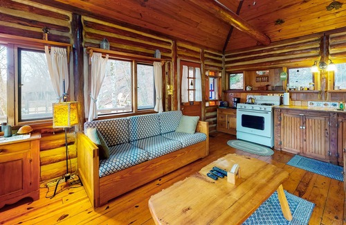 Eureka Springs Cabin | Lake Lucerne waterfront historic log cabin with large deck, grill & gas stove