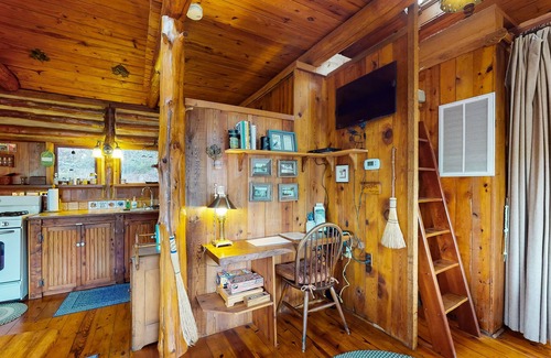 Eureka Springs Cabin | Lake Lucerne waterfront historic log cabin with large deck, grill & gas stove