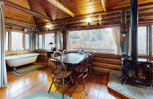 Eureka Springs Cabin | Lake Lucerne waterfront historic log cabin with large deck, grill & gas stove